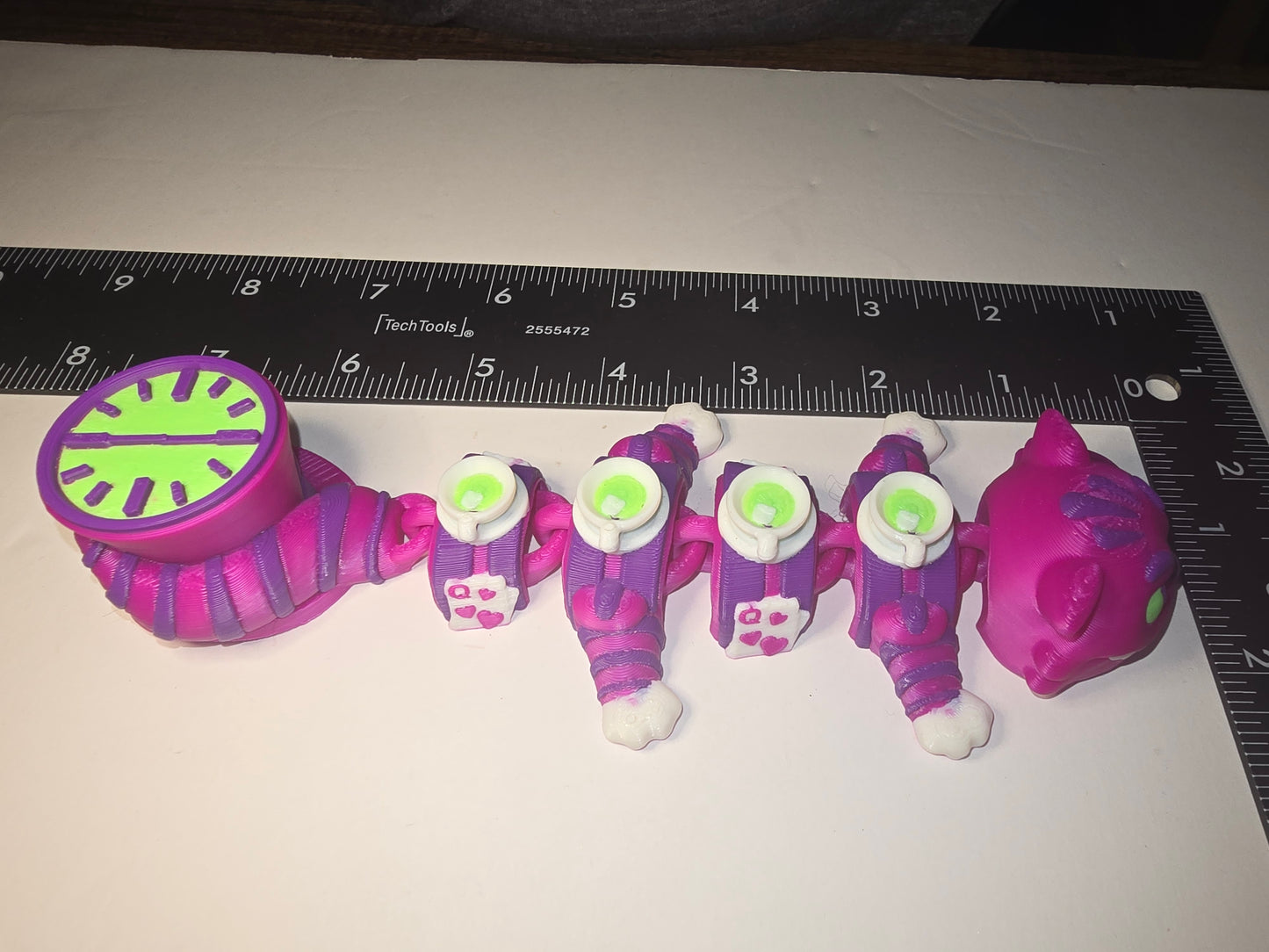 Small Alice and wonderland cat dragon