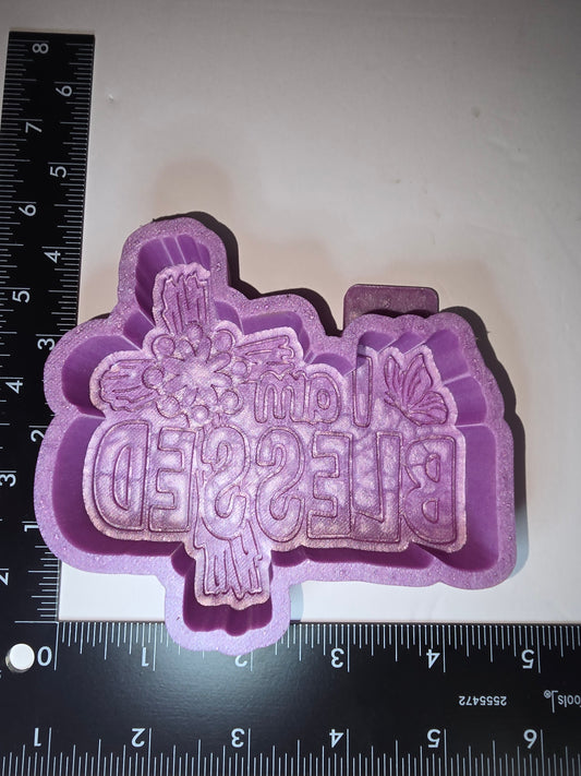 I am blessed with cross and butterfly silicone freshie mold